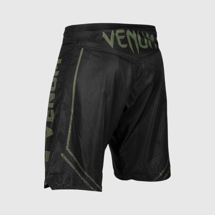 Rear view with large green Venum logo on waistband.