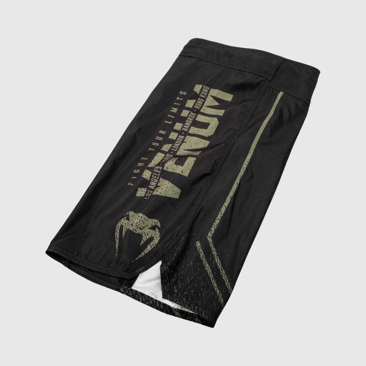 Flat lay of right leg showing full printed Venum typography and branding.