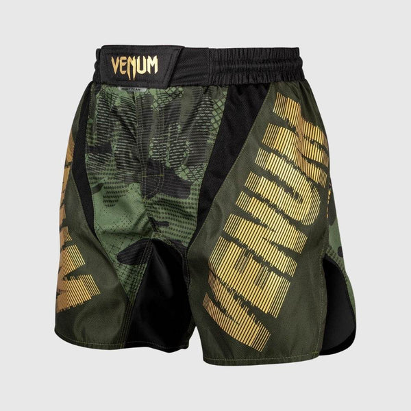 Front view of green camo Venum fight shorts with bold gold "VENUM" logo on both legs and elastic waistband.