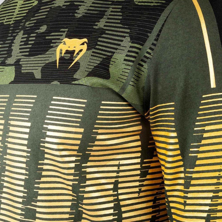 Detailed view of the yellow Venum snake logo and text graphic on the chest.