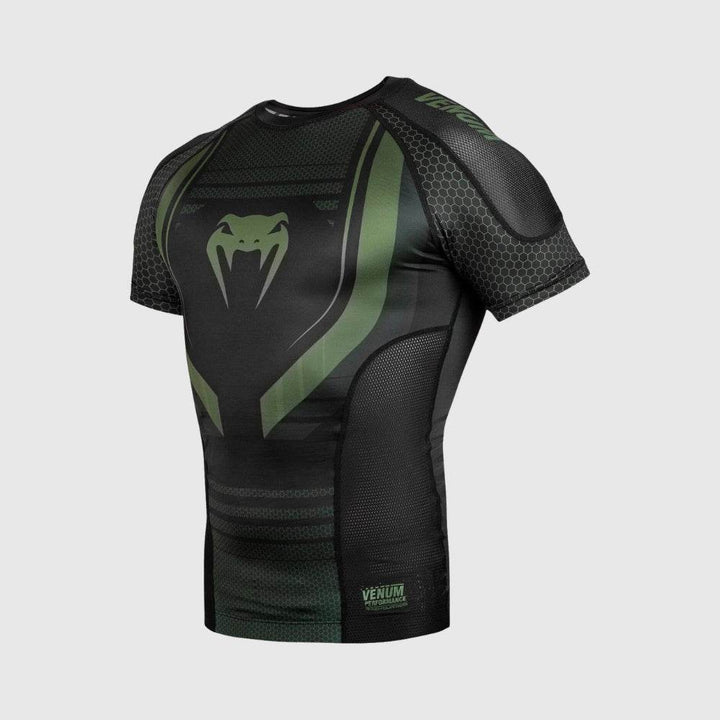 Three-quarter front view of the Venum rashguard showing shoulder detailing, side mesh panels, and Venum branding.