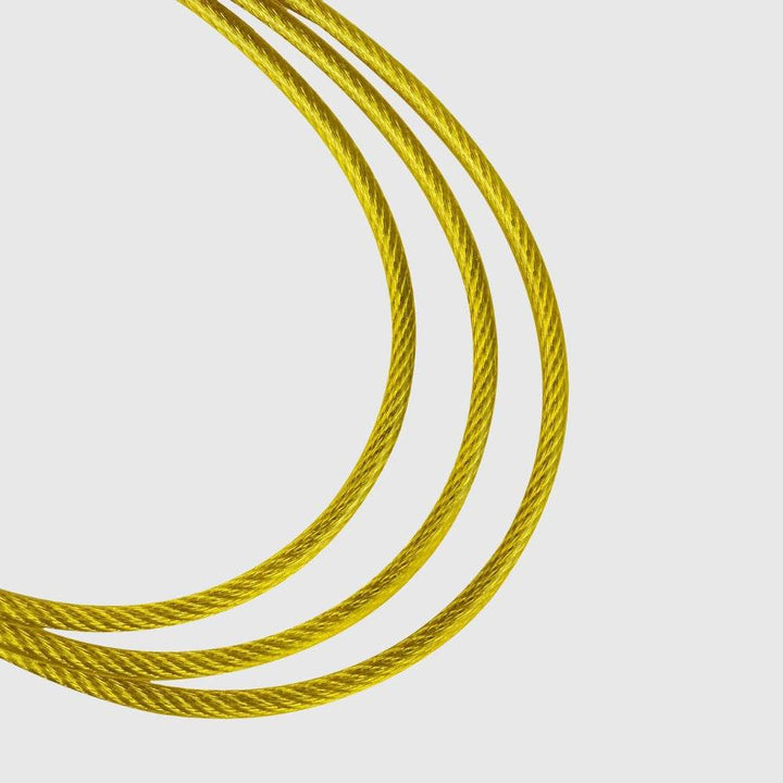 Detailed look at yellow coated steel cable showing braiding.