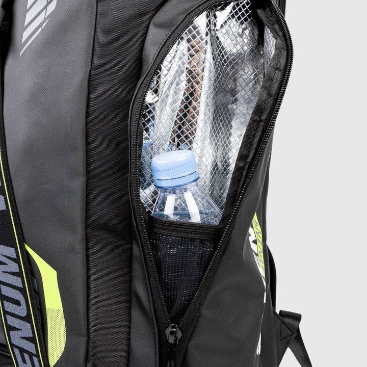 Close-up of the Venum backpack’s insulated side compartment with a mesh pocket holding a water bottle, designed to maintain temperature and keep contents secure.