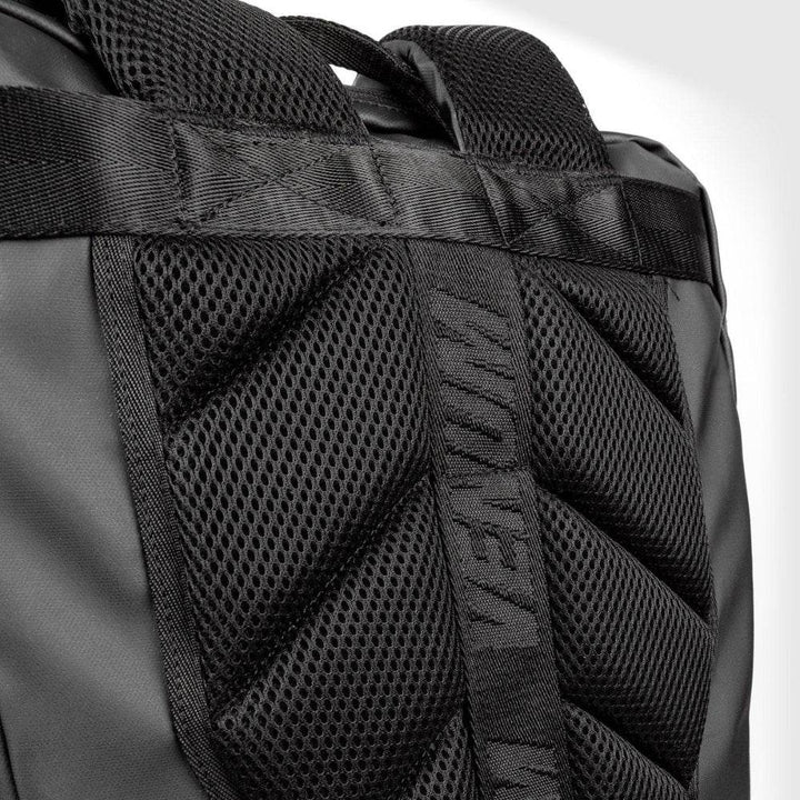 Close-up of the Venum backpack’s padded back panel with breathable mesh fabric and reinforced stitching, featuring subtle VENUM branding on the central strap.