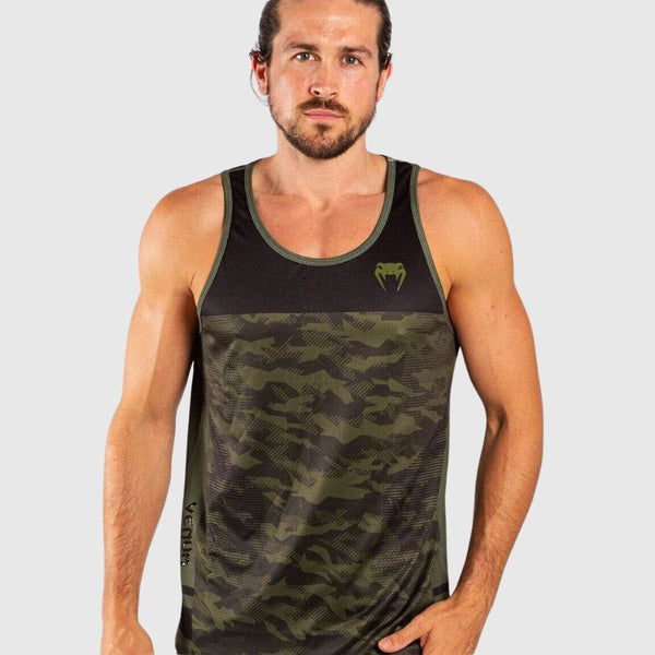 A male model wears the Venum Training Camp 3.0 tank top in green camo and black, featuring a fitted athletic cut and Venum logo on the chest.