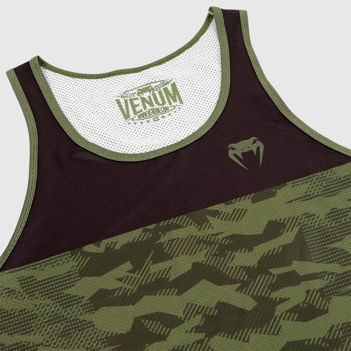 Close-up of the neckline and upper chest area with the internal Venum branding and textured mesh panel.