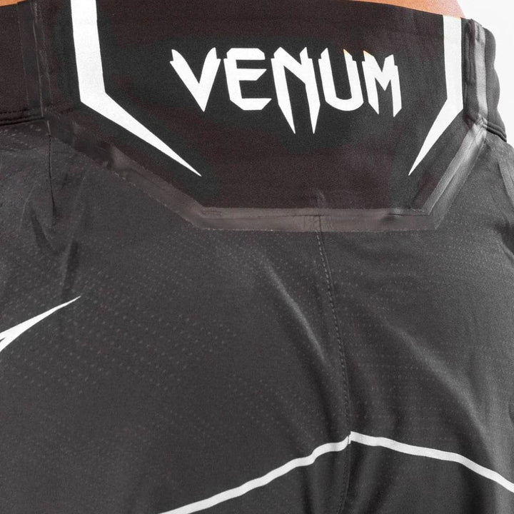Detailed view of the rear waistband displaying the Venum logo and white trim details with clean stitching.